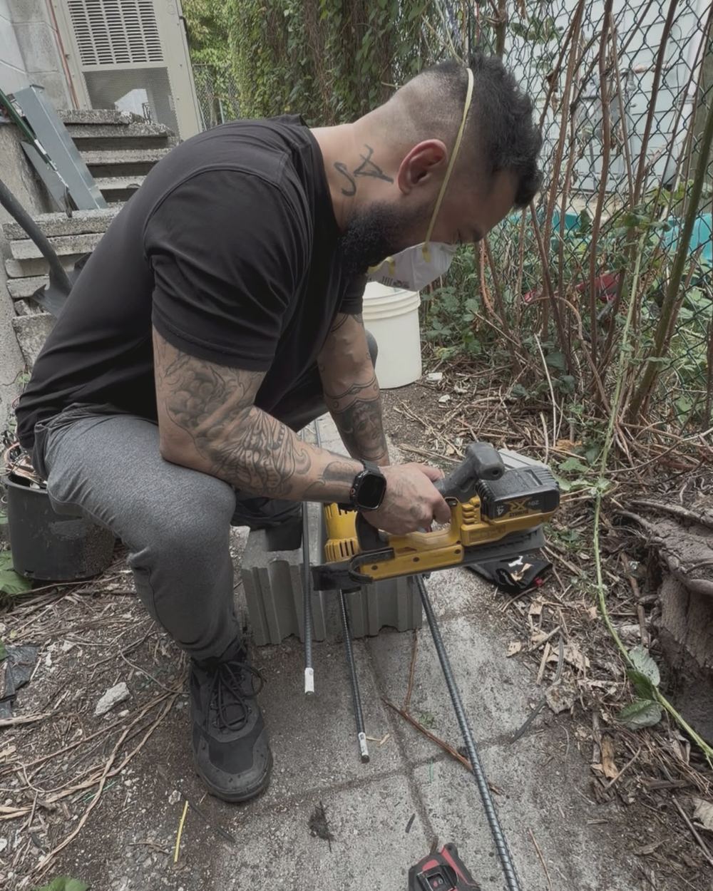 Uplift Contracting technician working on a garden repair