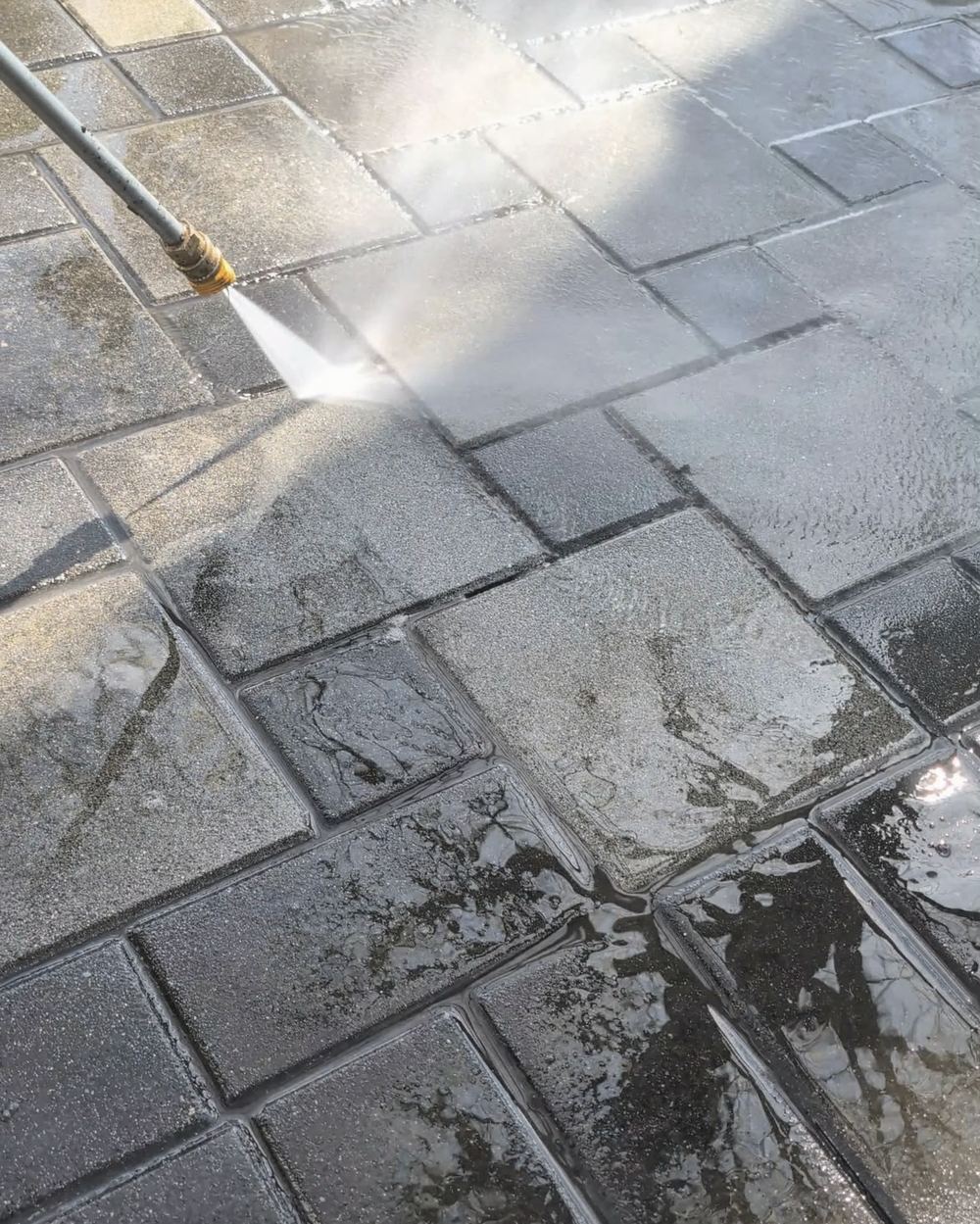 Pressure washing stone pavers in East Vancouver